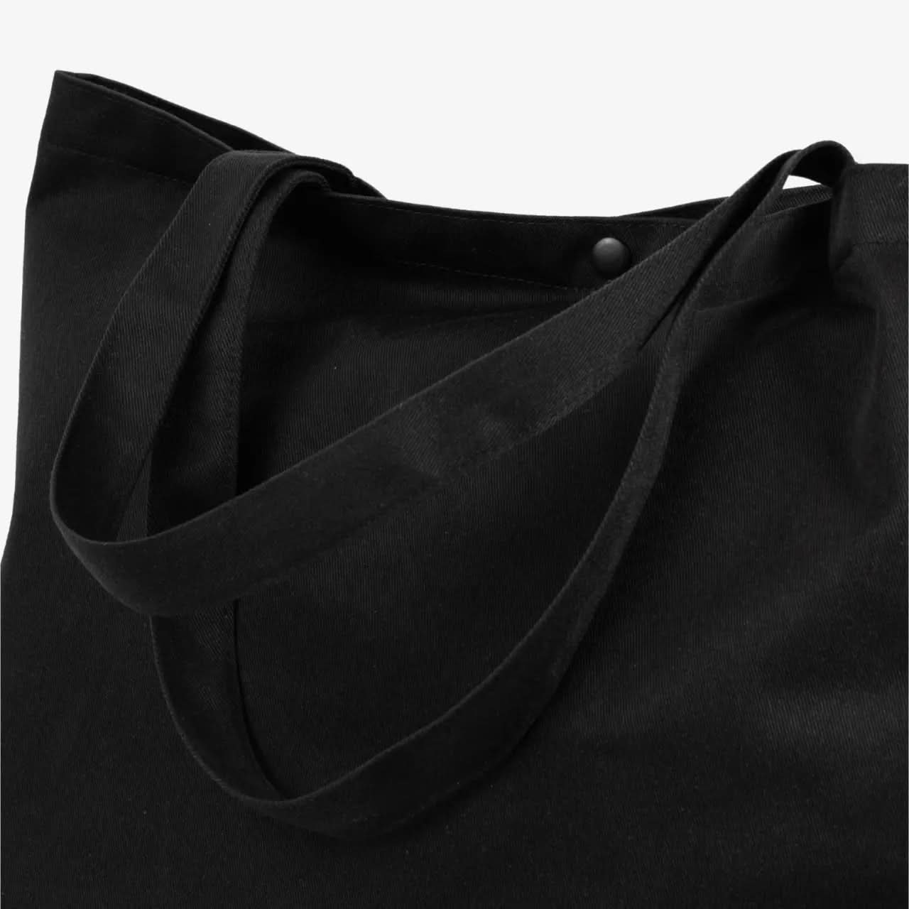 Close-up of Nectrum RPET tote handle: recycled plastic bottle fabric with double stitching